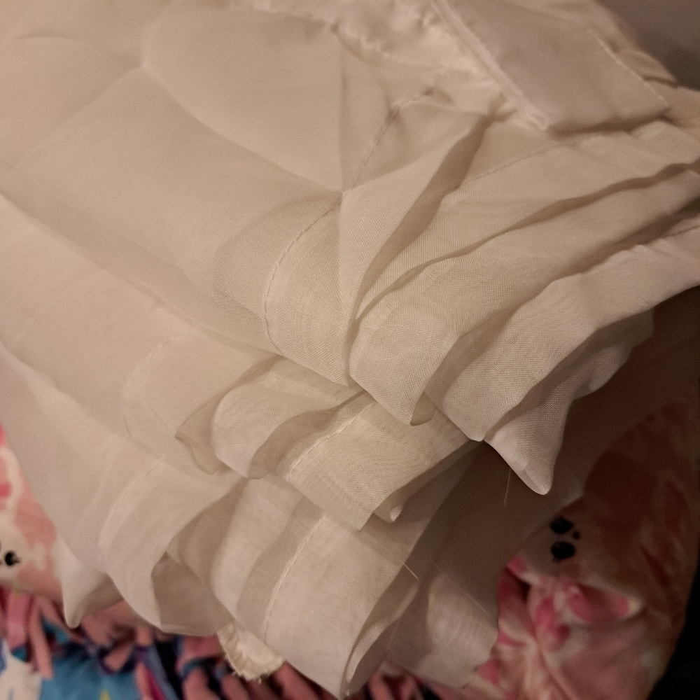2 panels of sheer curtains